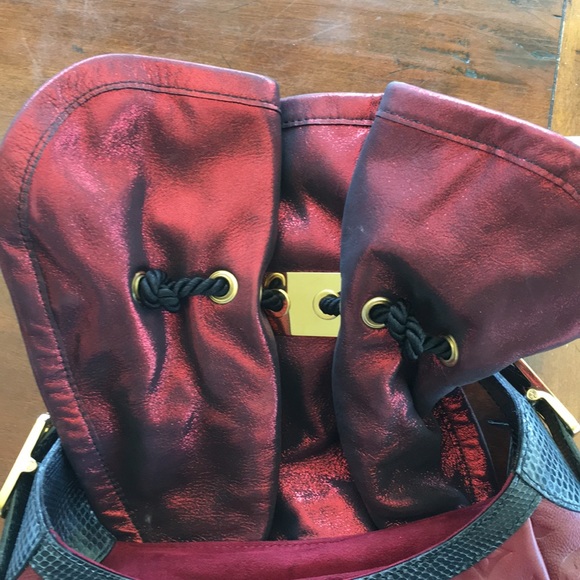 LOUIS VUITTON- Burgundy Kalahari hand bag.